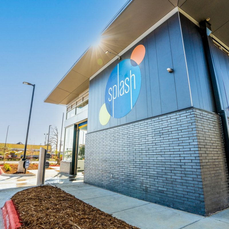 Side of Sherwood Splash Car Wash building with Splash logo.